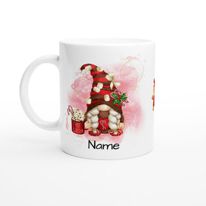 Introducing the Personalised Christmas Gonk Mug: a white mug adorned with a charming gnome sporting braided hair and a red hat decorated with marshmallows and a green bow. The gnome holds a cup labeled "Hot Cocoa," There's space underneath for adding your custom name. Pink watercolor splashes lend a festive flair, making it the ideal customisable Christmas mug.