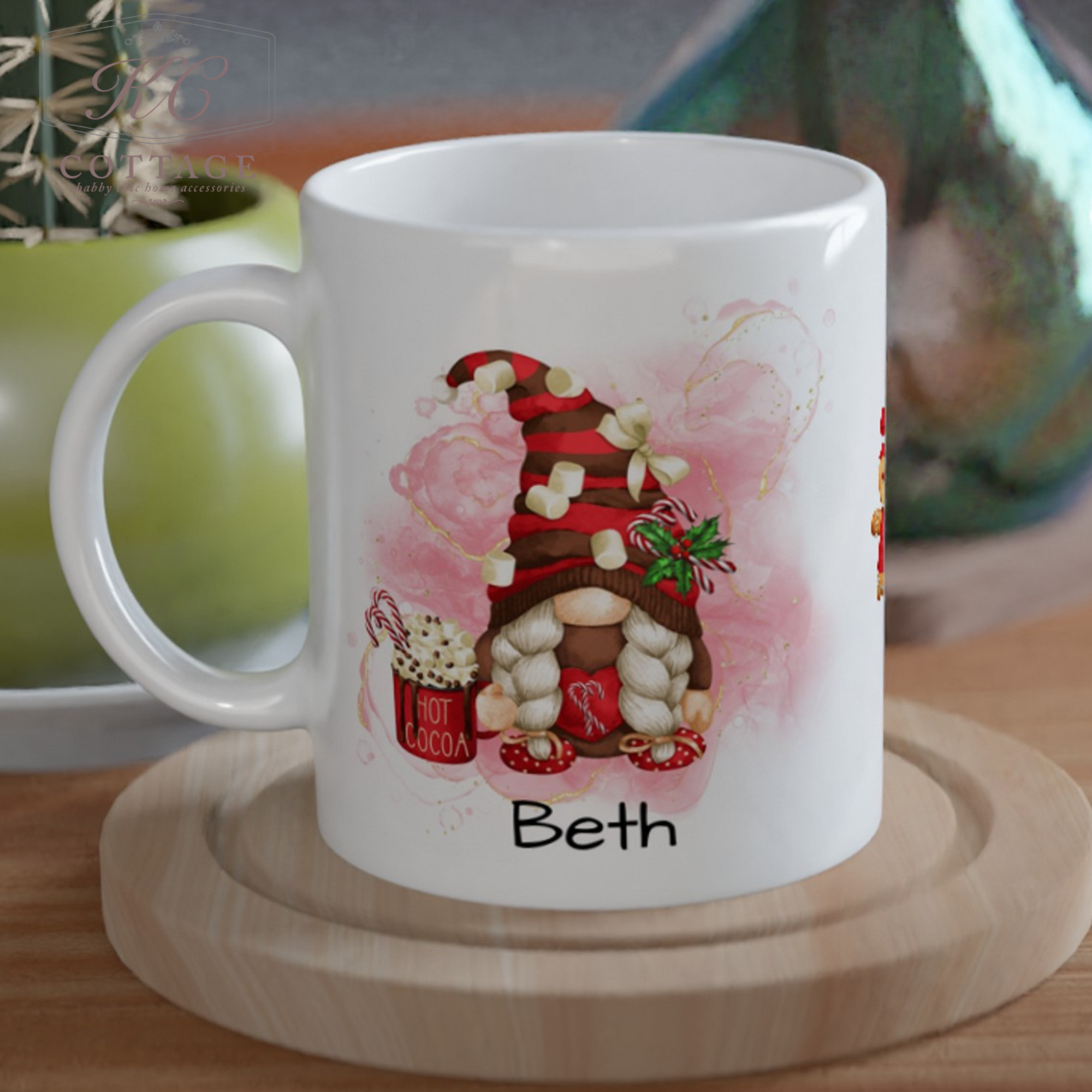 Product Description: Personalised Christmas Gonk Mug for Beth. This white mug features a festive gnome in a red-and-white striped hat, holding a steaming "Hot Cocoa" mug. The background includes pink hearts and decorative accents, perfect for adding a festive touch. The mug comes with a wooden coaster.